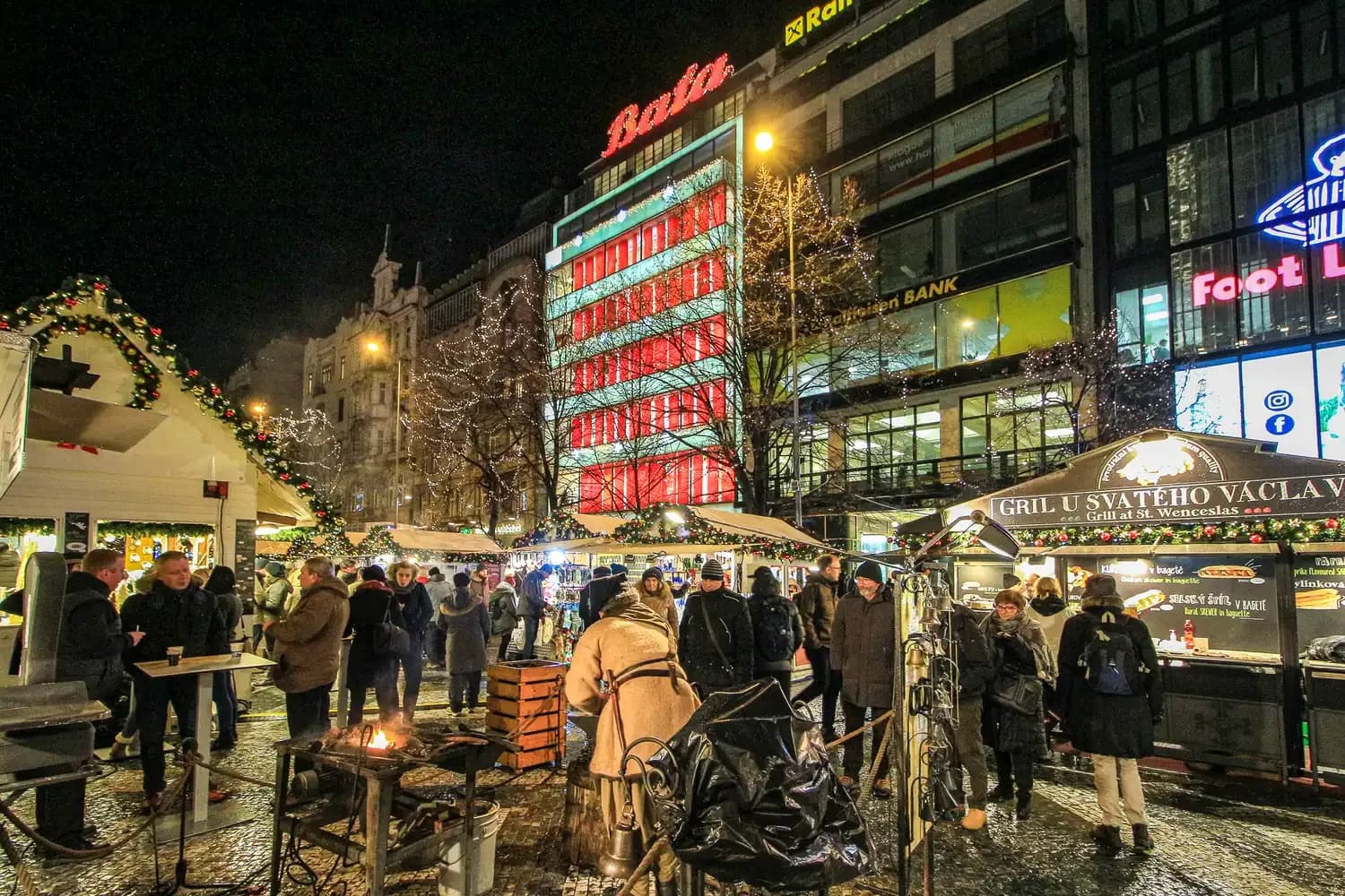 Christmas market stalls on Wenceslas Square in Prague at night | BudgetBro 