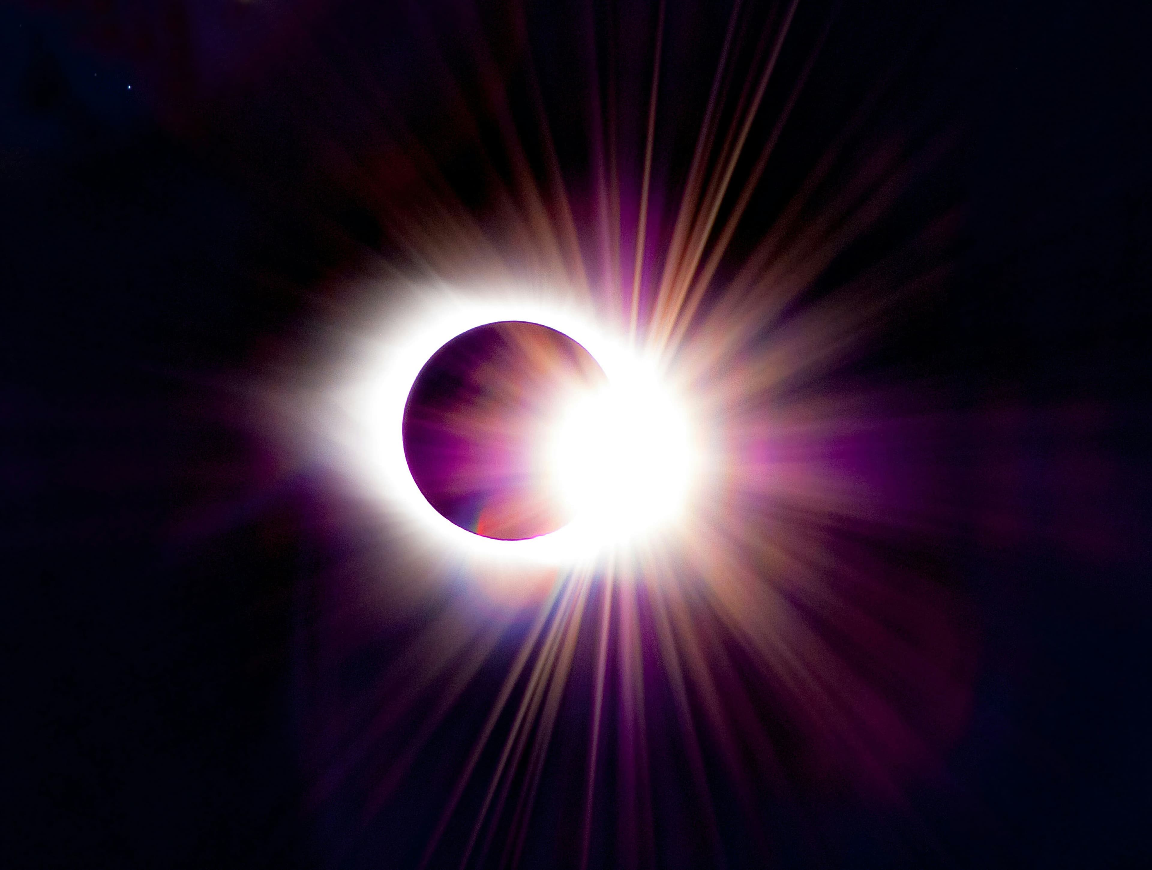 A total solar eclipse showing the sun's corona around the darkened moon