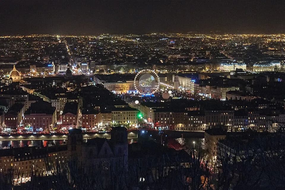 Lyon lit up at night during the Fête des Lumières, seen from above | BudgetBro