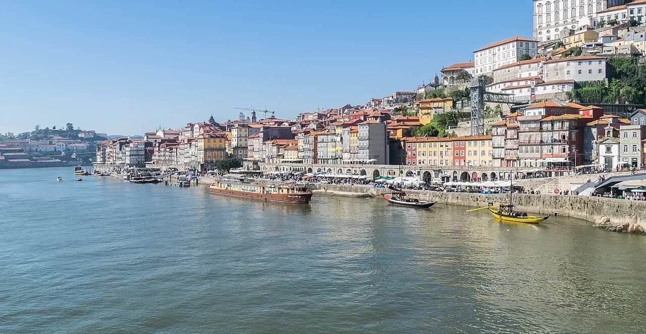 Ribeira waterfront in Porto seen across the Douro river | BudgetBro