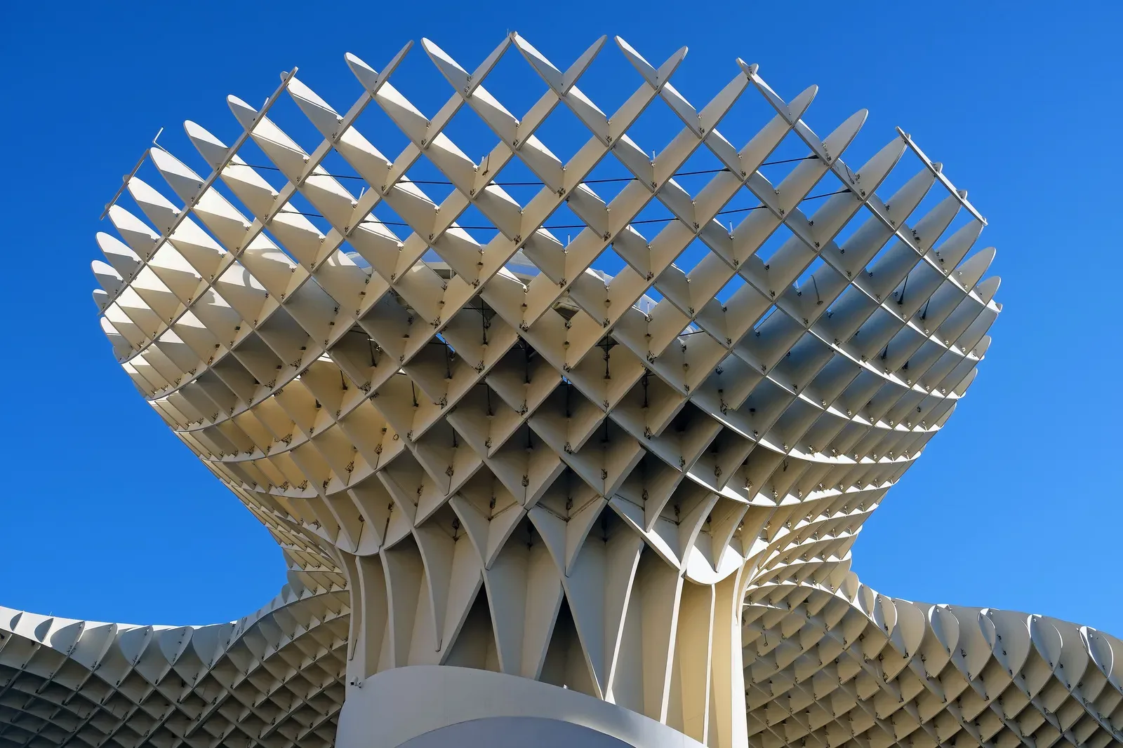 The wooden Setas de Sevilla (Metropol Parasol) against a blue sky | BudgetBro