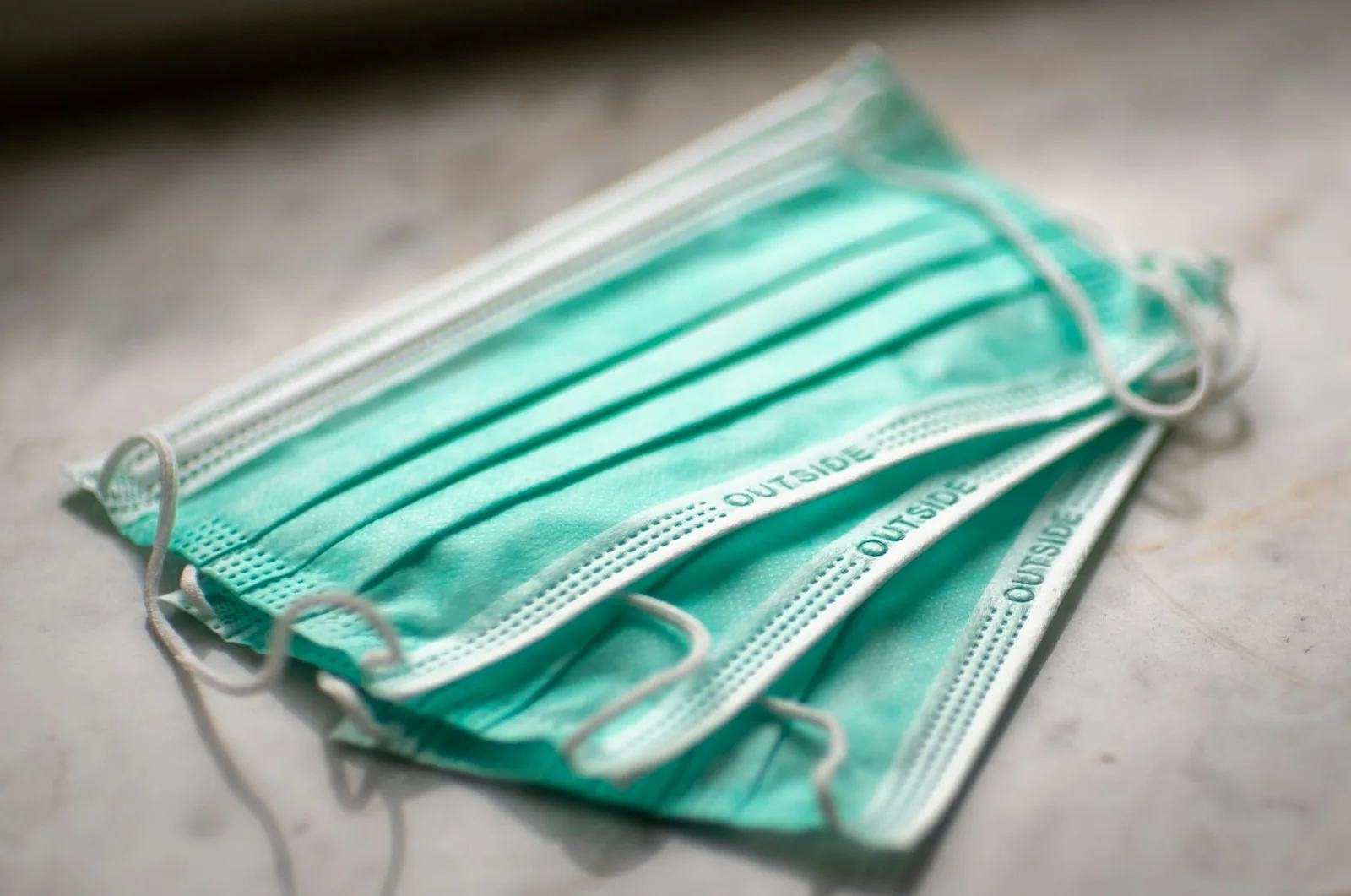 Teal disposable medical face masks, reflecting Vietnam's communicable disease prevention measures | BudgetBro