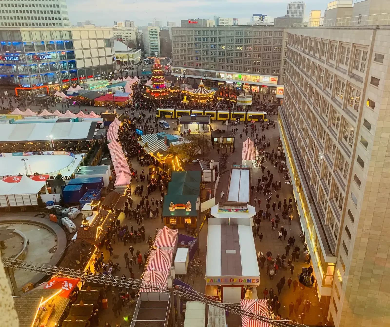 Alexanderplatz Christmas market in Berlin seen from above, with stalls, rides and crowds | BudgetBro