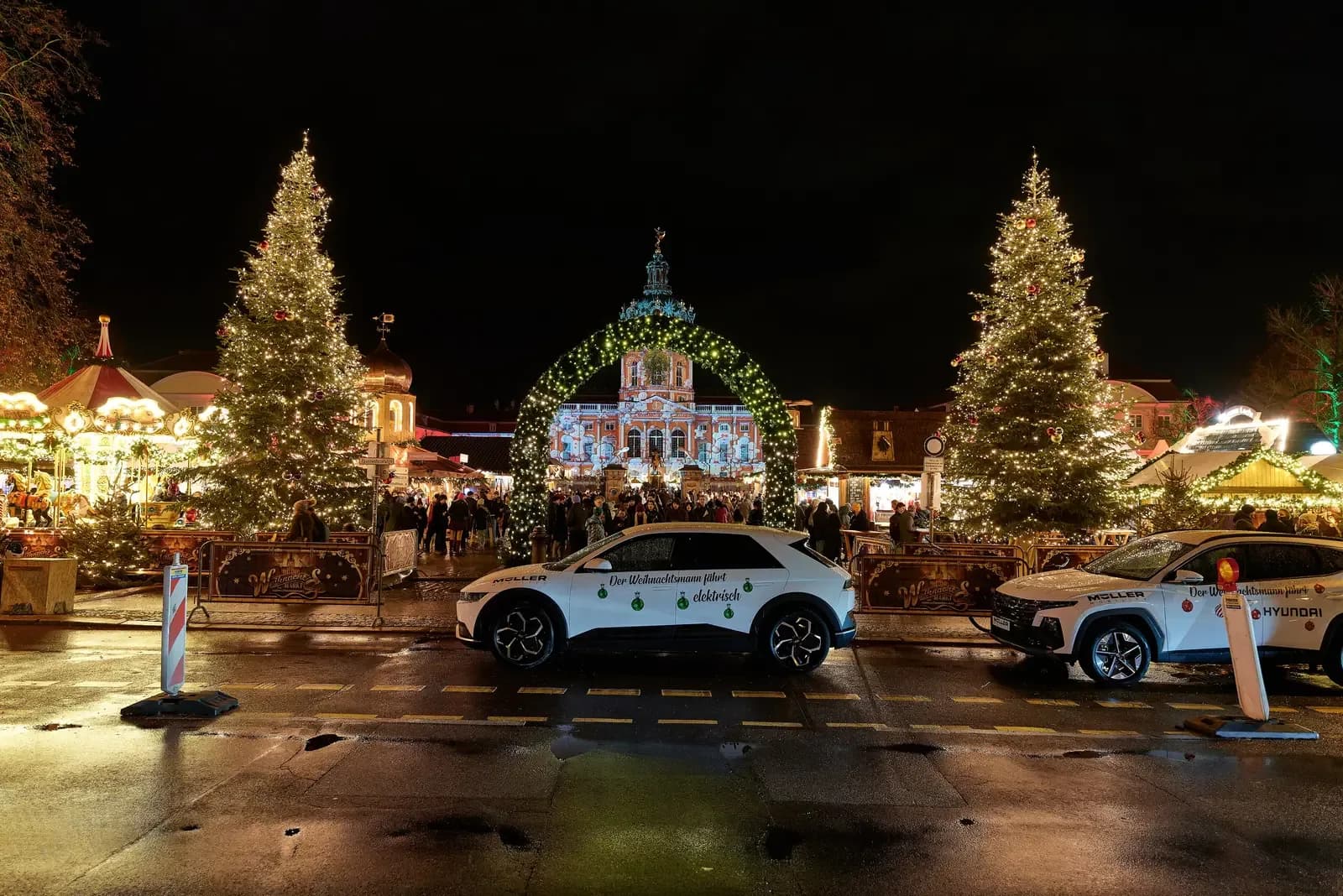 Christmas market stalls around the statue in front of Charlottenburg Palace in Berlin at night | BudgetBro
