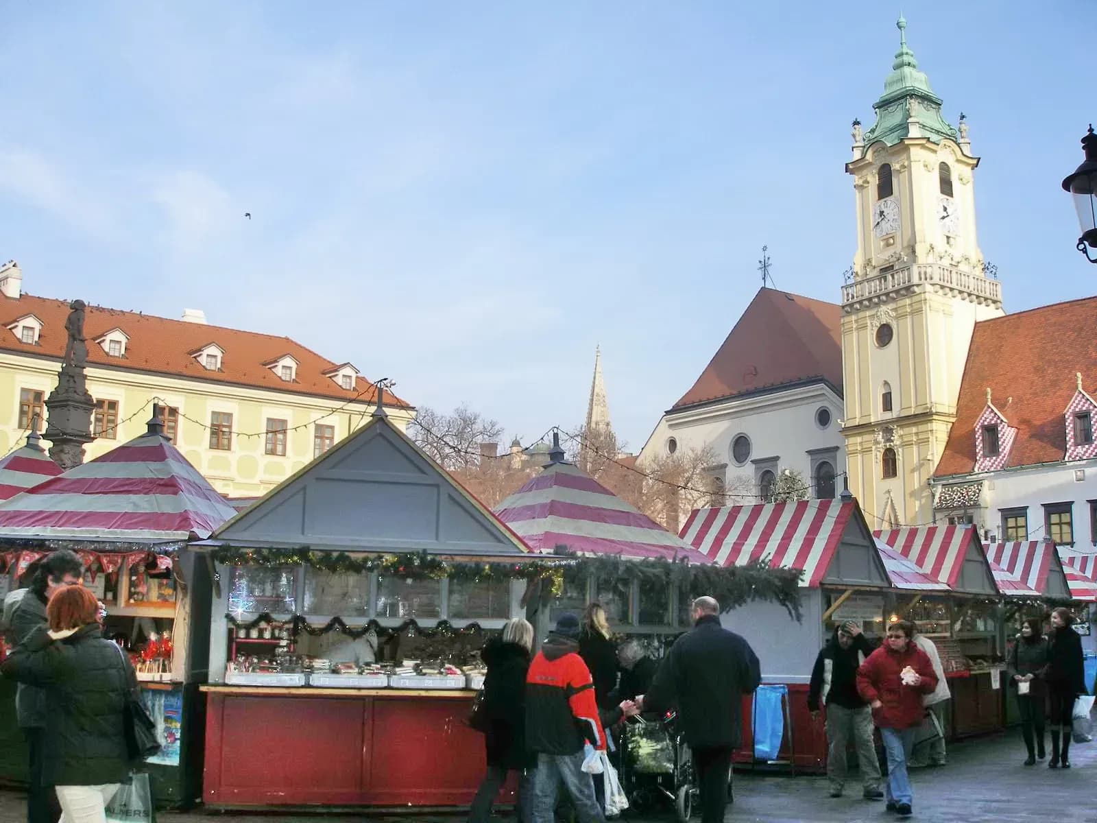 Christmas market stalls on Bratislava's Main Square below the Old Town Hall tower | BudgetBro