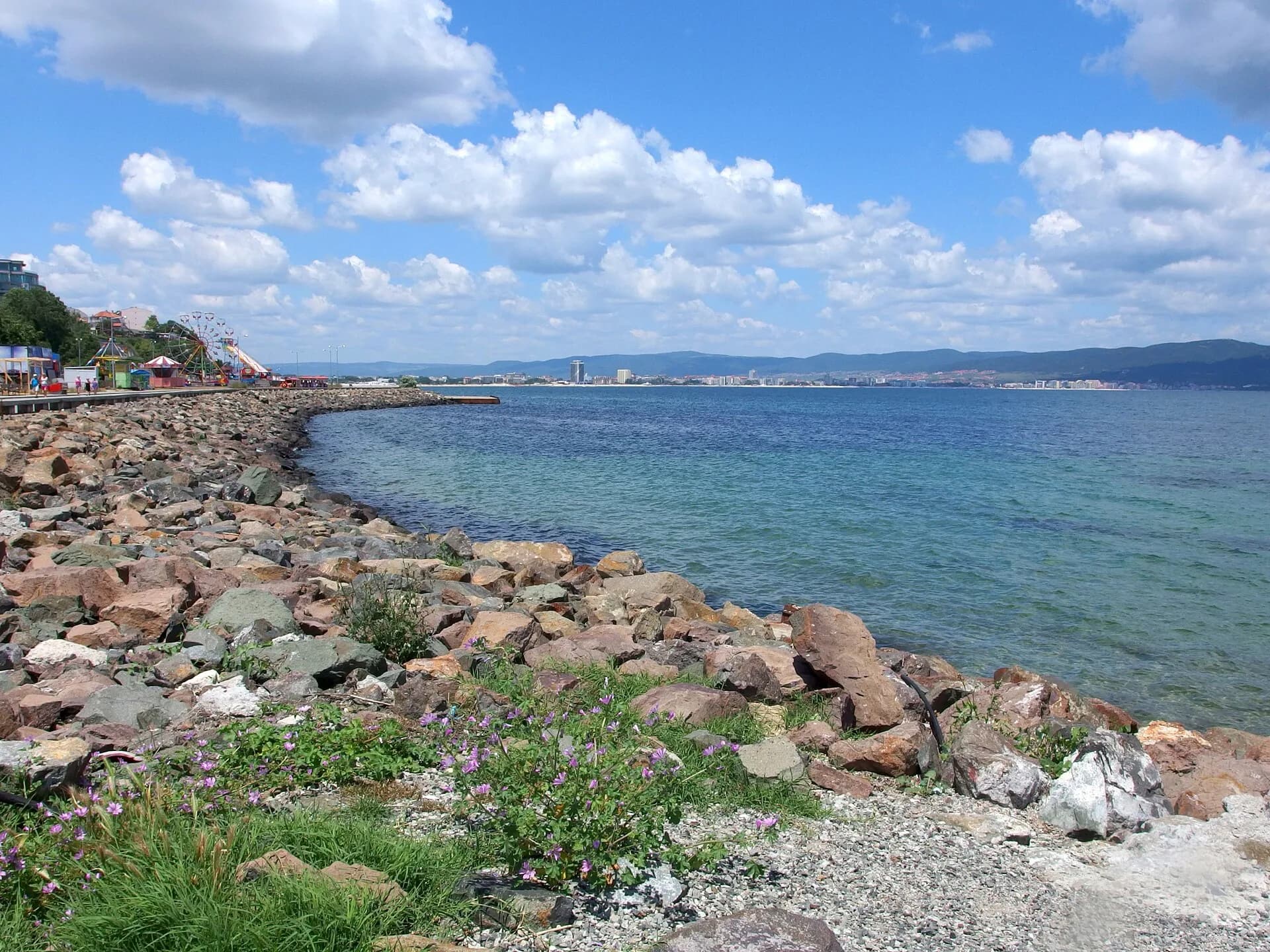 The rocky Black Sea shoreline near Burgas in Bulgaria on a clear summer day, close to the 2027 Eurovision host city | BudgetBro