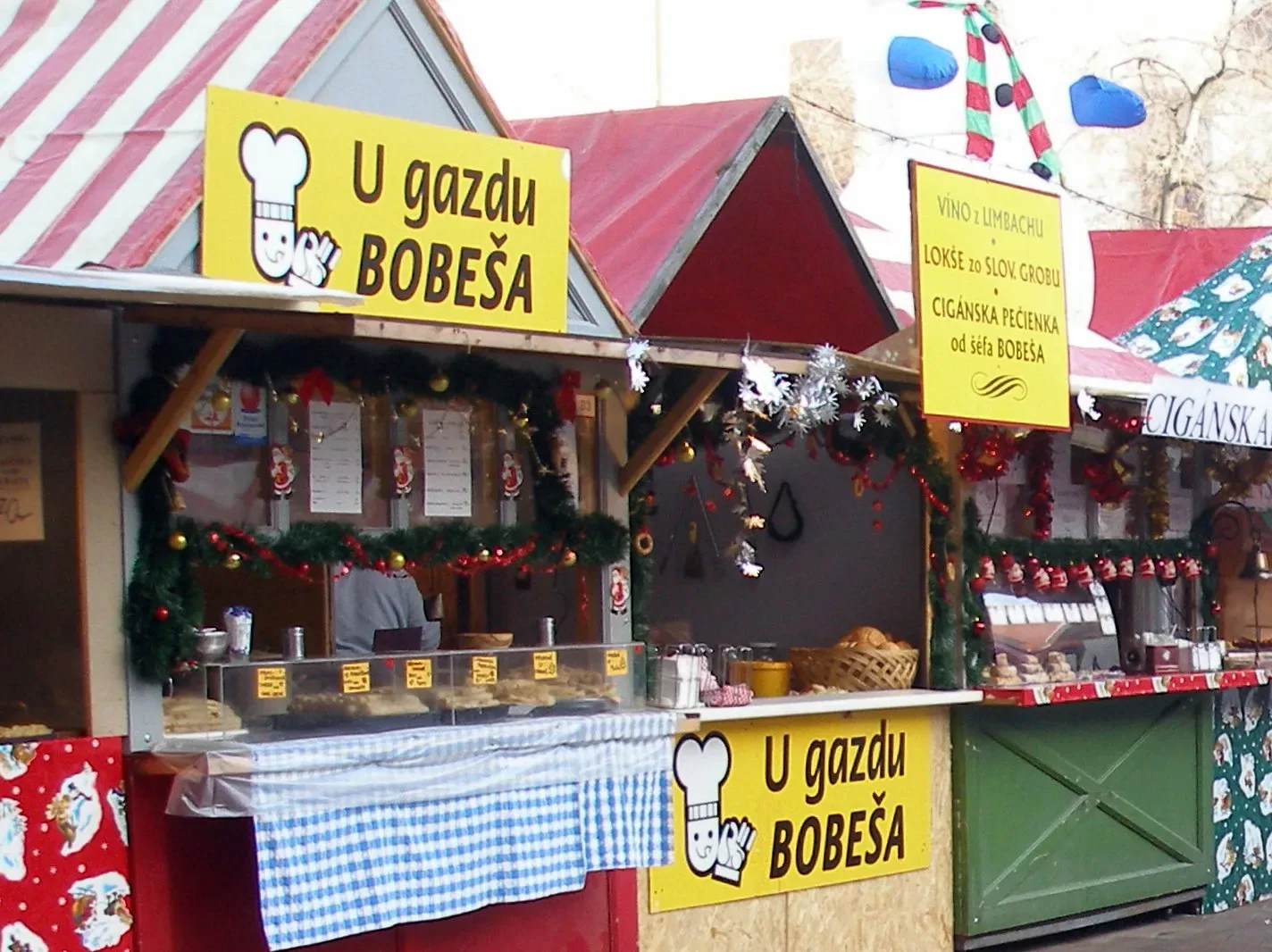 Wooden Christmas market stall with a red and white roof in Bratislava | BudgetBro