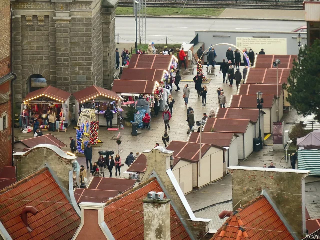 Wooden stalls of the Gdańsk Christmas market seen from above
